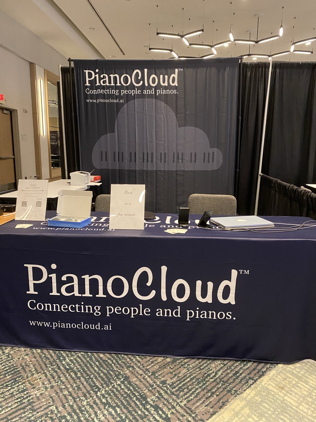 PianoCloud booth backdrop and table at PTG 2026